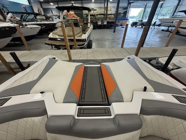 Slide: The Image of The image shows the stern of a 2017 Tigé Z3 boat in a storage facility. - 30