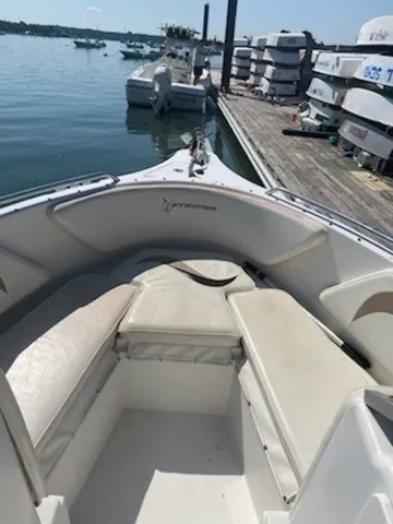 Slide: The Image of The image shows the bow of a 2004 Seaswirl 2101 DC Striper with seating benches. - 5