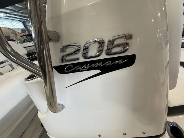 Slide: The Image of Close-up of the "206 Cayman" lettering on a white boat. - 25