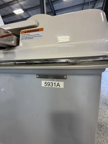 Slide: The Image of Close-up of a boat detail with a warning label and serial number. - 26