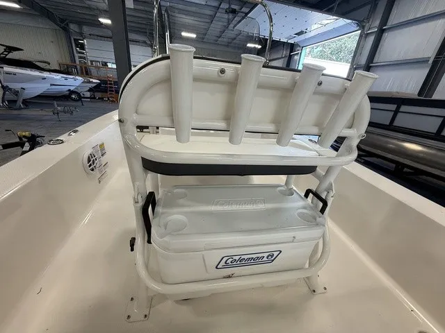 Slide: The Image of The image shows the cockpit of a 2023 Robalo 206 Cayman with a Coleman cooler and rod holders. - 14