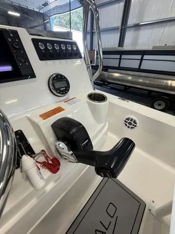 Slide: The Image of The image shows the cockpit of a 2023 Robalo 206 Cayman with controls and instruments. - 19