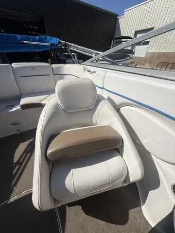 Slide: The Image of A luxurious white seat with brown accents in a 2008 Four Winns H220 boat. - 28