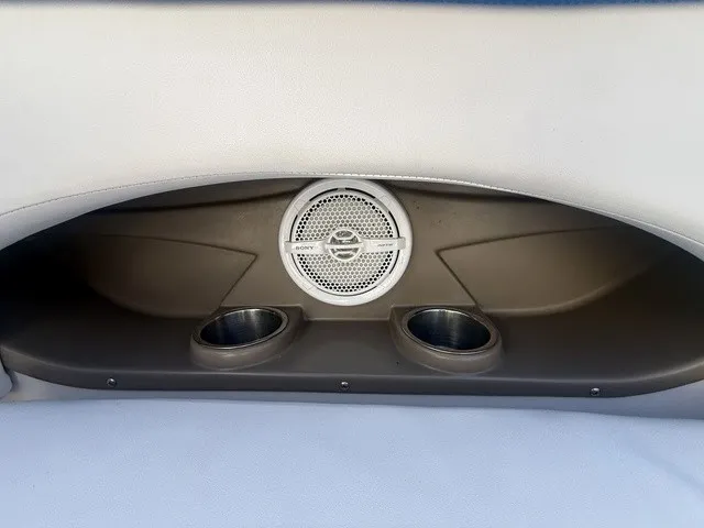Slide: The Image of A speaker and two cup holders are integrated into the back of a boat seat. - 32