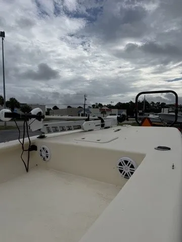 Slide: The Image of A 2022 Jones Brothers Bateau 17 is parked in a lot. The sky is cloudy. - 5