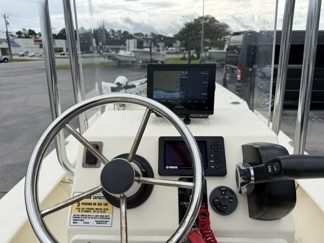 Slide: The Image of Helm of a Jones Brothers Bateau 17 with steering wheel and electronics. - 7