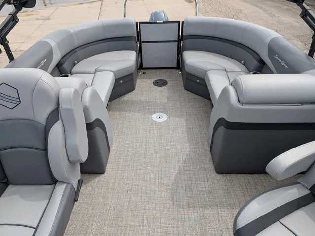 Slide: The Image of The image shows the interior of a 2024 South Bay S222RS 25" boat with gray upholstery. - 7