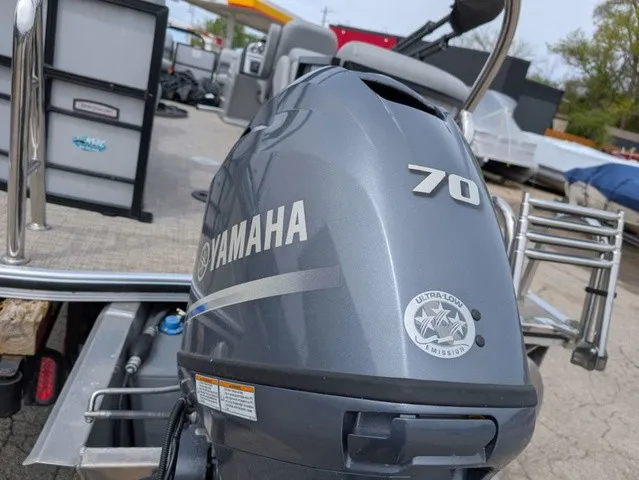 Slide: The Image of A Yamaha 70 outboard motor is mounted on a South Bay S222RS 25" boat. - 8