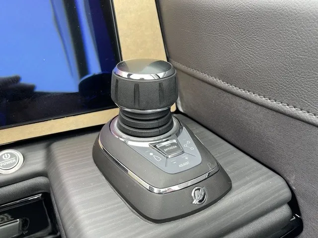 Slide: The Image of Close-up of a modern joystick on a boat, surrounded by a screen and padded surfaces. - 27