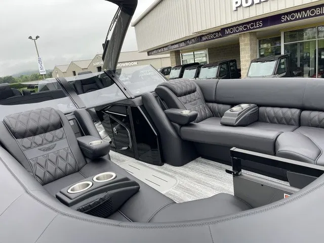 Slide: The Image of Luxurious seating with quilted leather and cup holders in a modern boat. - 15