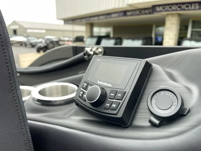 Slide: The Image of Close-up of a boat console area with an audio system and USB charging port. - 29