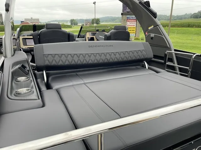 Slide: The Image of The image shows the luxurious interior of a 2026 Bennington QX Swingback 27 QXSBWAT2. - 31