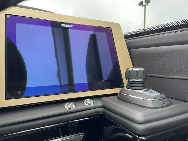 Slide: The Image of A modern navigation system with a large screen and joystick on a boat. - 26