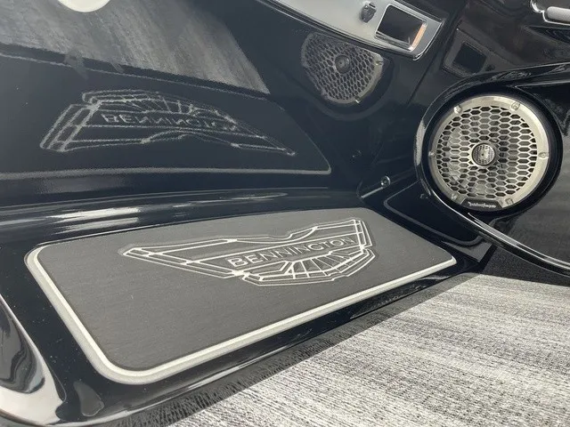 Slide: The Image of Close-up of a Bennington boat with speaker and logo on a mat. - 33