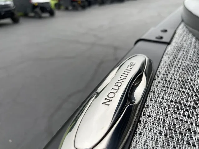Slide: The Image of Close-up of a Bennington boat with a sleek metal handle and textured fabric. - 16