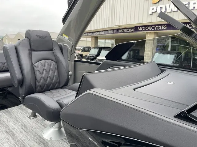 Slide: The Image of Luxurious seating area of a 2026 Bennington QX Swingback 27 QXSBWAT2 with sleek gray upholstery. - 20
