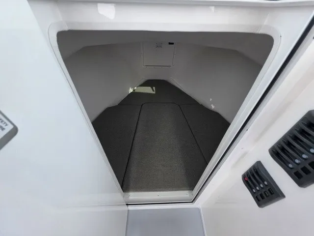 Slide: The Image of Interior view of a 2027 Steiger Craft 23 Miami with gray carpet flooring. - 7