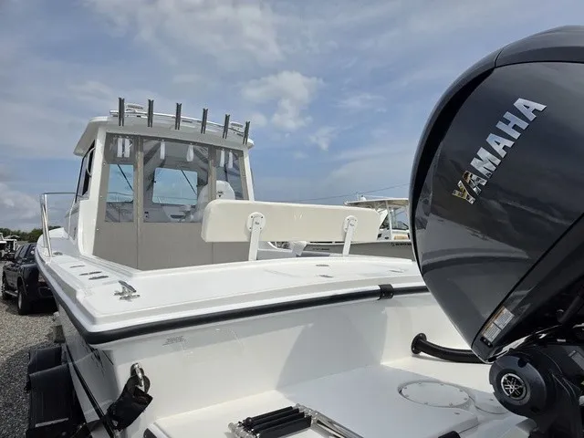 Slide: The Image of Steiger Craft 23 Miami 2027 with Yamaha outboard motor, spacious deck, and fishing rod holders. - 9