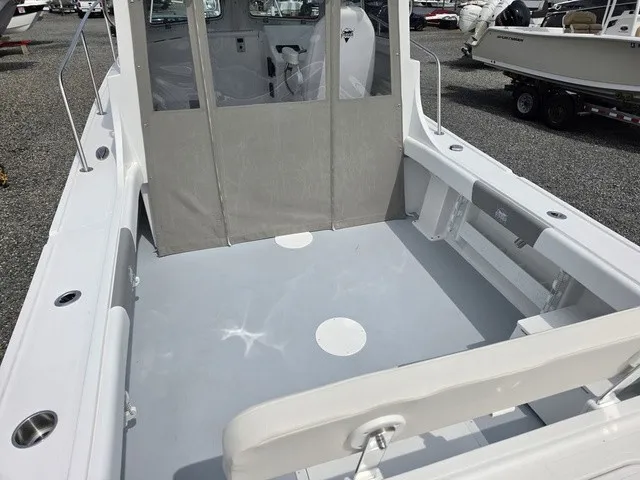 Slide: The Image of Steiger Craft 23 Miami 2027: Spacious cockpit with gray flooring and sturdy seating. - 6