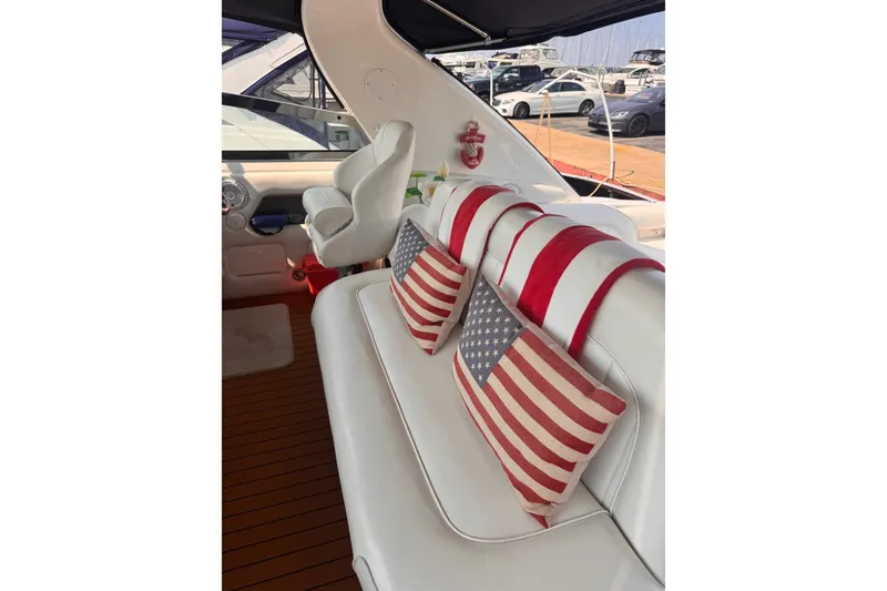 Slide: The Image of Interior of 1997 Sea Ray 450 Sundancer with American flag decor and white seating. - 16