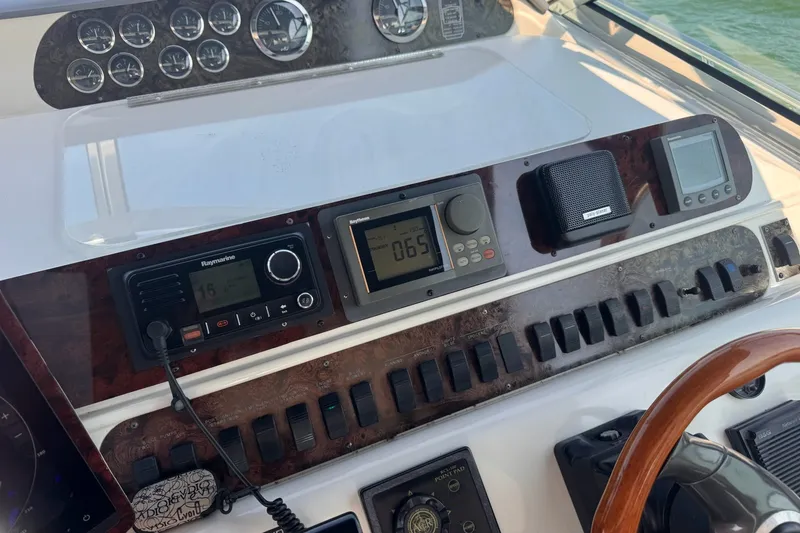 Slide: The Image of Control panel of a 1997 Sea Ray 450 Sundancer boat with navigation instruments. - 20