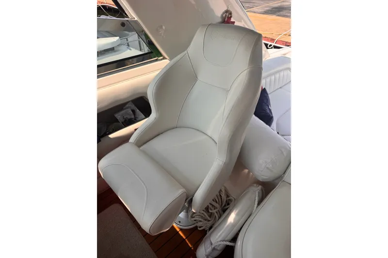 Slide: The Image of White captain's chair on 1997 Sea Ray 450 Sundancer yacht. - 15
