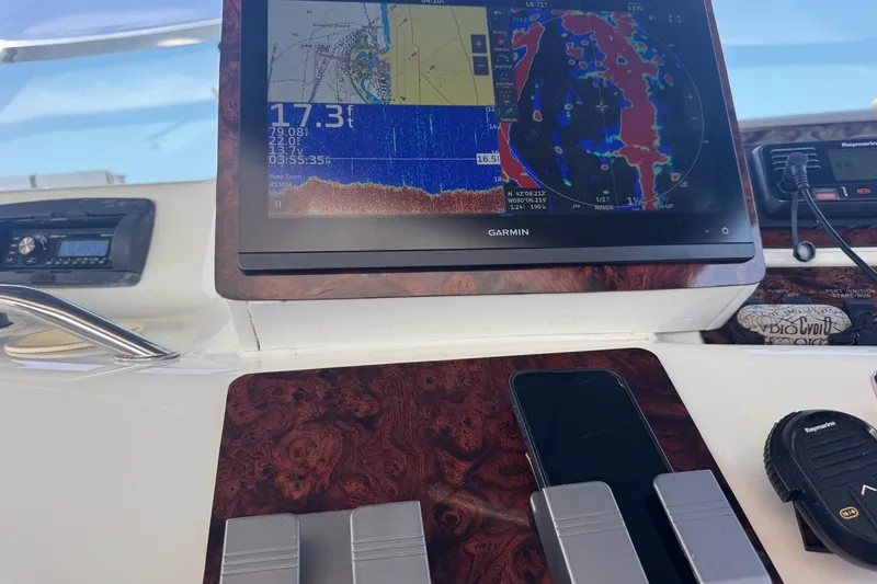 Slide: The Image of Control panel of a 1997 Sea Ray 450 Sundancer with Garmin navigation display. - 22
