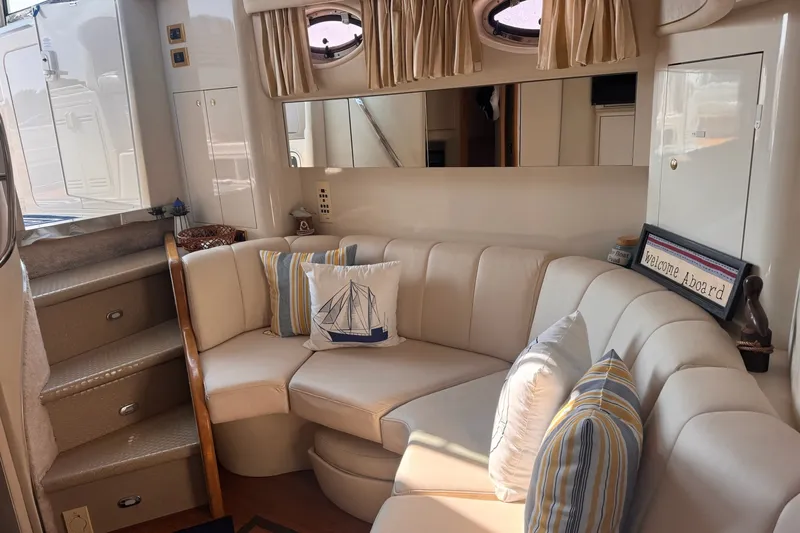 Slide: The Image of Luxurious interior of 1997 Sea Ray 450 Sundancer yacht with cozy seating and nautical decor. - 27