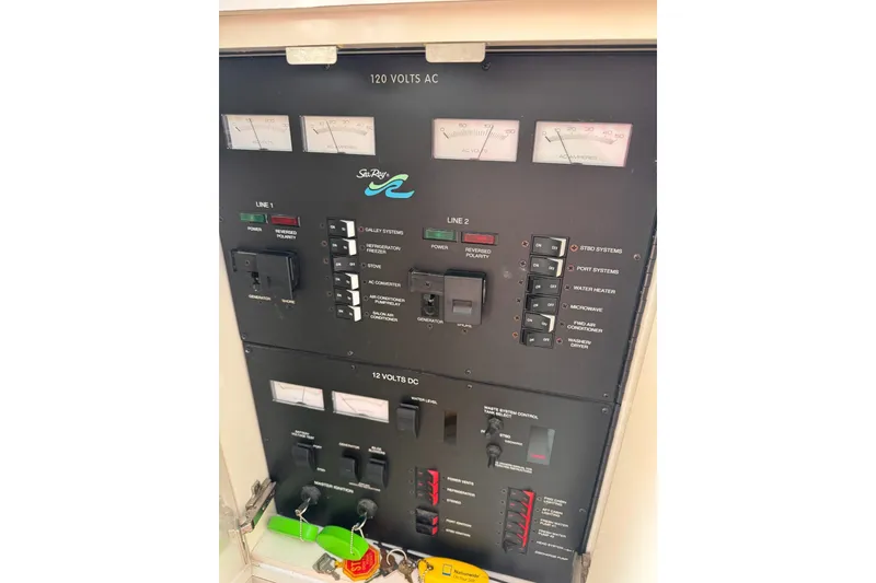 Slide: The Image of Electrical control panel of a 1997 Sea Ray 450 Sundancer boat. - 24