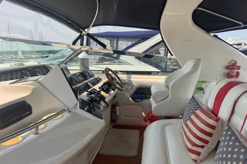 Slide: The Image of Interior of a 1997 Sea Ray 450 Sundancer yacht with American-themed decor. - 17