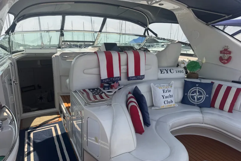 Slide: The Image of Luxurious 1997 Sea Ray 450 Sundancer yacht interior with nautical-themed decor and plush seating. - 12