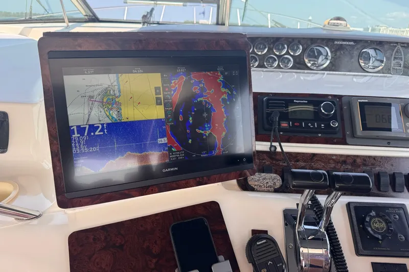 Slide: The Image of Control panel of a 1997 Sea Ray 450 Sundancer with Garmin navigation display. - 21