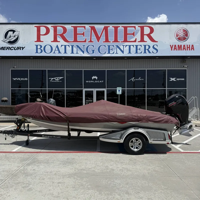 Slide: The Image of A 2019 Ranger Z518 boat on a trailer in front of a boating center. - 33