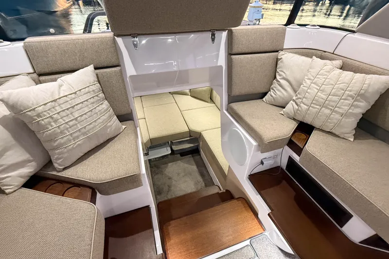 Slide: The Image of Luxurious interior of 2024 Axopar 45 XC Cross Cabin with plush seating and cushions. - 22