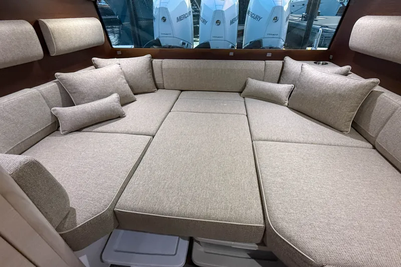 Slide: The Image of Luxurious interior seating of 2024 Axopar 45 XC Cross Cabin with plush cushions. - 25