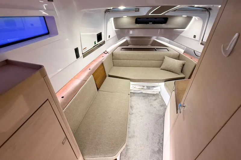 Slide: The Image of 2024 Axopar 45 XC Cross Cabin interior with modern seating and sleek design. - 35