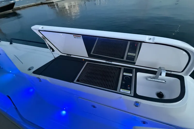 Slide: The Image of Outdoor kitchen on 2024 Axopar 45 XC Cross Cabin boat with grill and sink. - 8