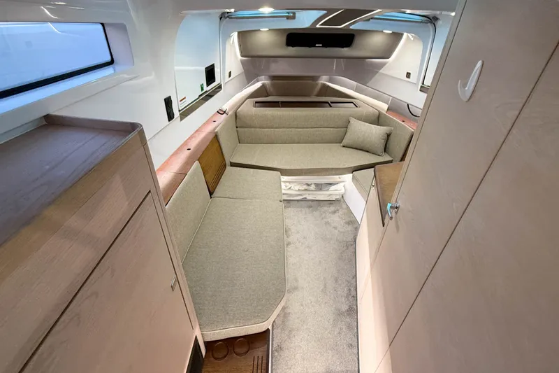 Slide: The Image of 2024 Axopar 45 XC Cross Cabin interior with modern seating and sleek design. - 36