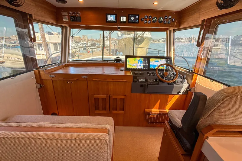 Slide: The Image of Interior of 2026 Targa 41 boat with modern navigation equipment and wooden finish. - 28