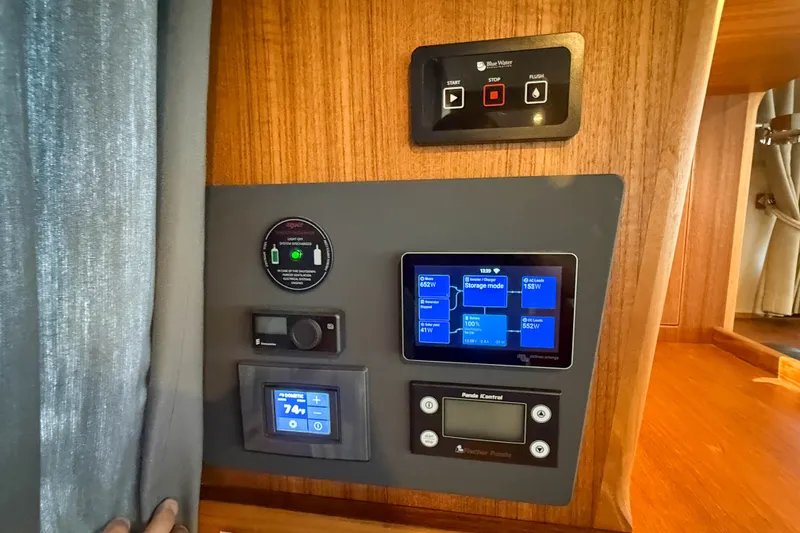 Slide: The Image of Control panel of a 2026 Targa 41 boat, featuring digital displays and switches. - 67