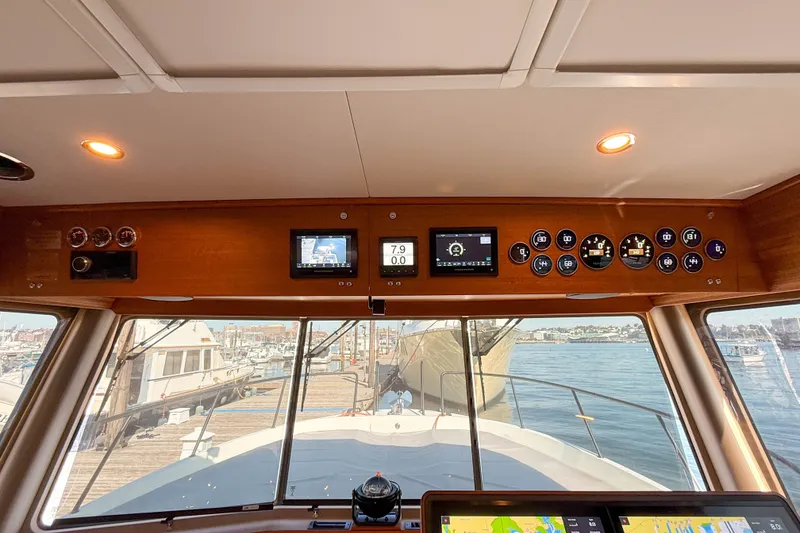 Slide: The Image of Helm of 2026 Targa 41 yacht with advanced navigation instruments and sea view. - 35