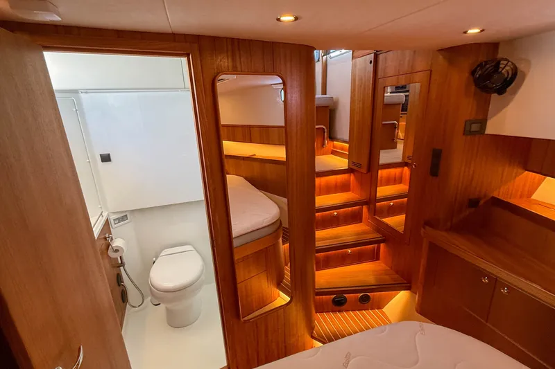 Slide: The Image of Luxurious interior of 2026 Targa 41 yacht featuring wood paneling and modern bathroom. - 40