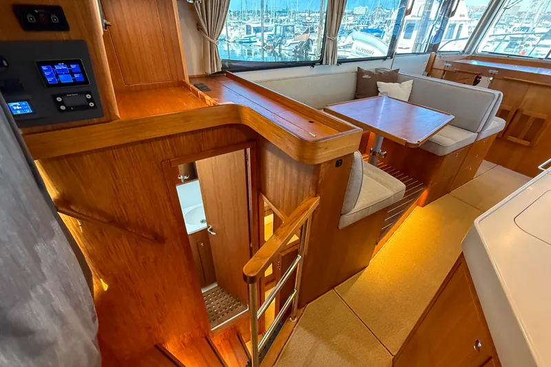 Slide: The Image of Luxurious interior of 2026 Targa 41 yacht with wooden finishes and cozy seating area. - 45