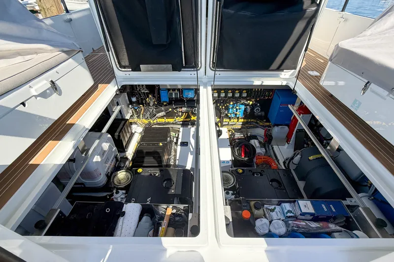 Slide: The Image of Engine compartment of 2026 Targa 41 boat, showcasing organized mechanical components and storage. - 60