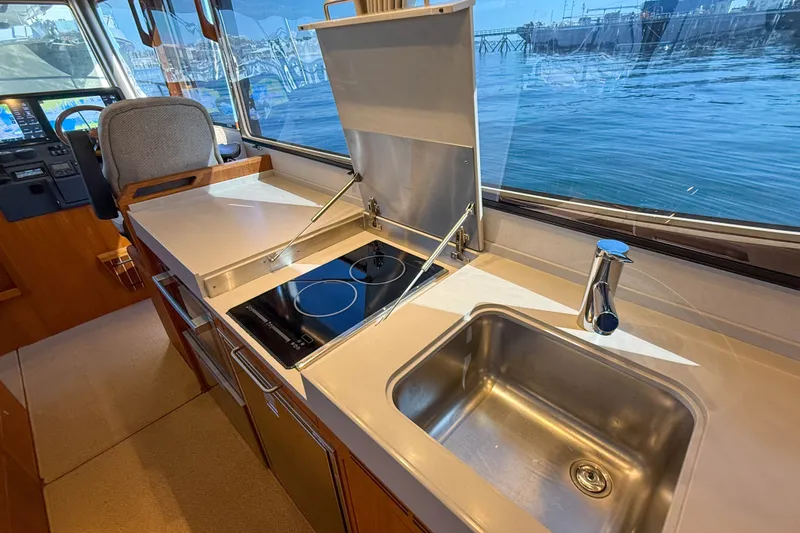 Slide: The Image of Modern kitchen area in 2026 Targa 41 boat with stove and sink. - 25