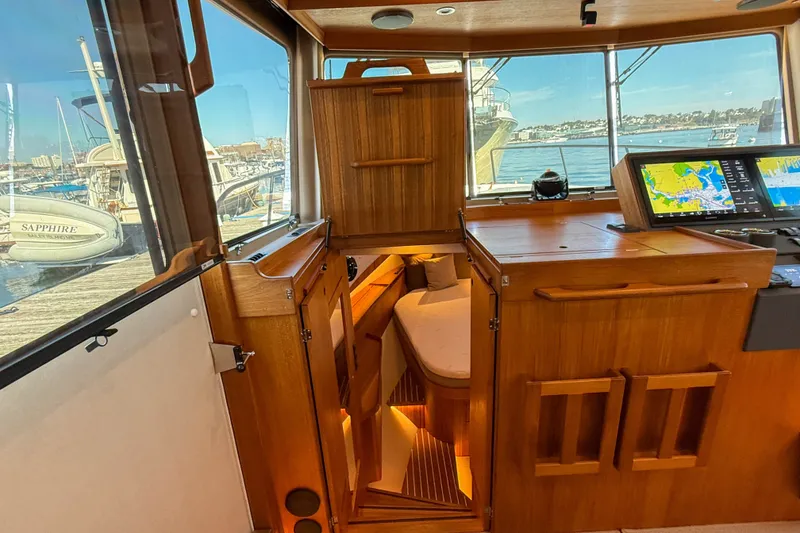 Slide: The Image of Interior of 2026 Targa 41 boat with wooden cabinetry and navigation screens. - 36