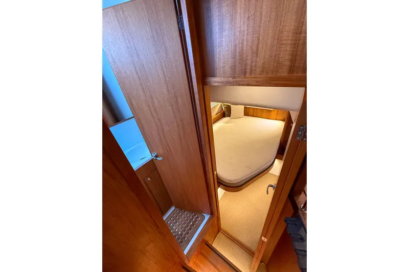 Slide: The Image of 2026 Targa 41 yacht interior with wooden finish and cozy bedroom. - 46