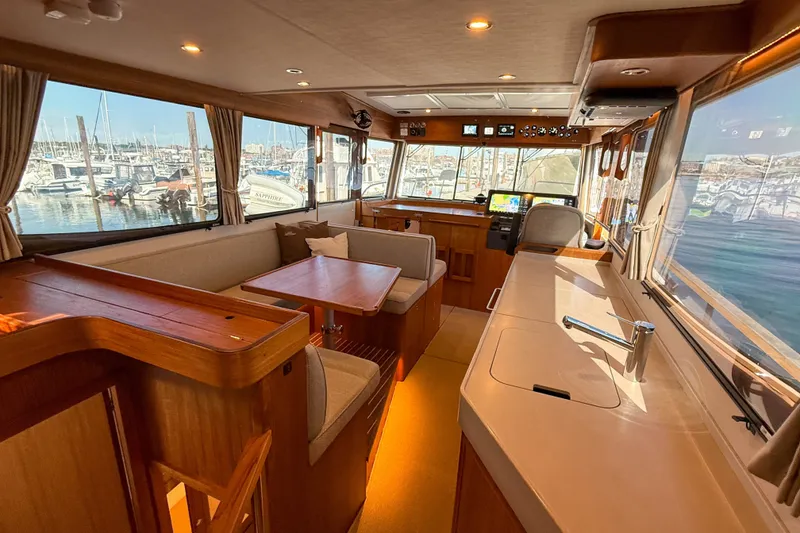 Slide: The Image of Luxurious interior of 2026 Targa 41 yacht with elegant wood finishes and marina view. - 20