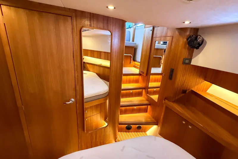 Slide: The Image of Luxurious interior of 2026 Targa 41 yacht with wooden finishes and cozy lighting. - 39