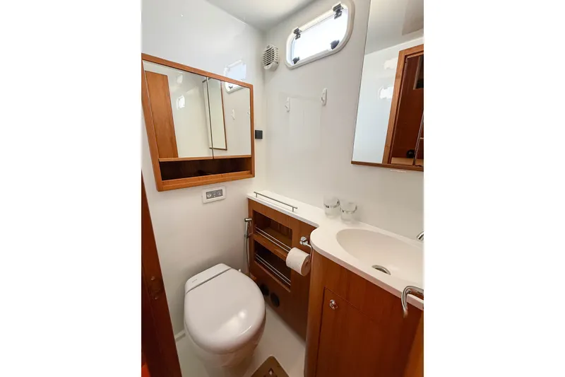 Slide: The Image of Modern bathroom in 2026 Targa 41 yacht, featuring sleek wood cabinetry and compact design. - 53
